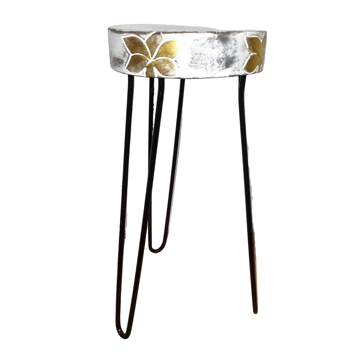 Small round table with metallic finish and butterfly design on a wooden surface.