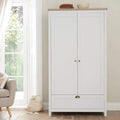 White wardrobe with oak top, double doors, and brass round knobs