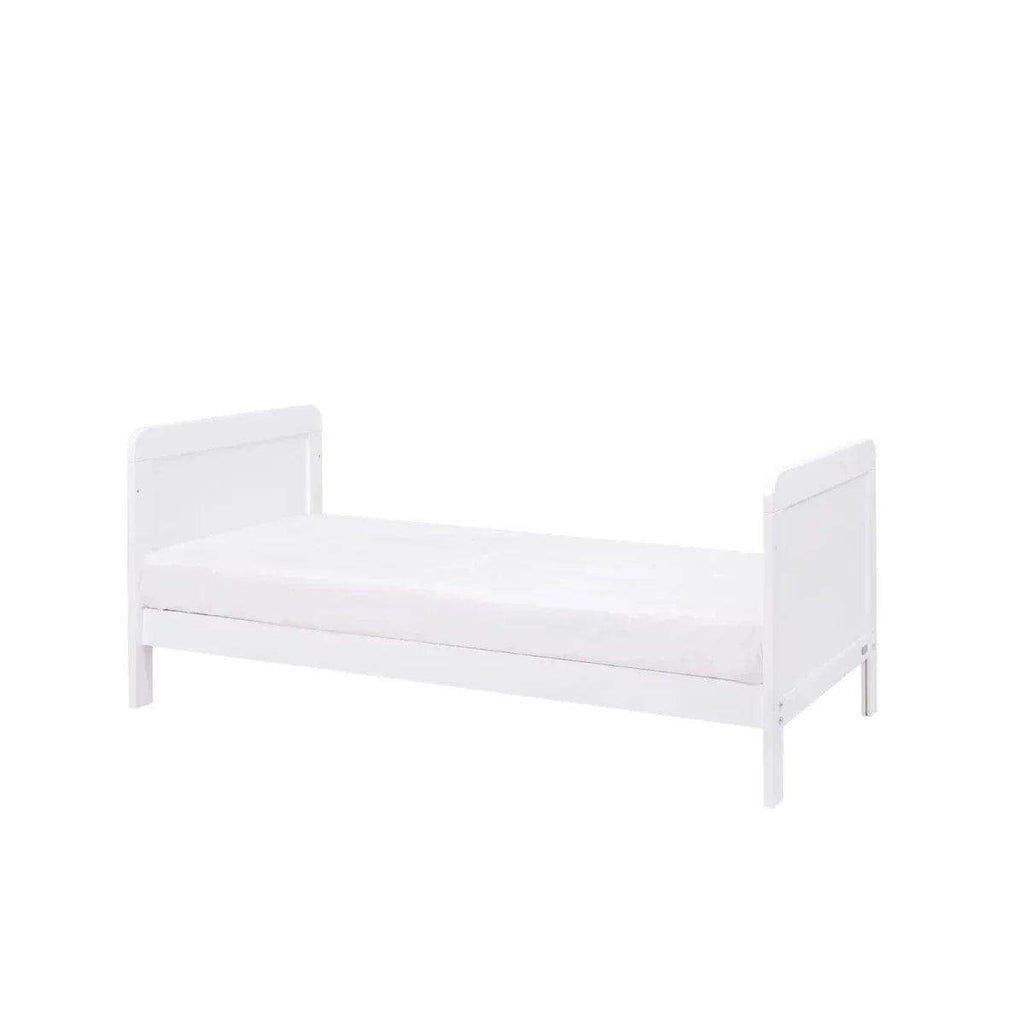 White junior bed-style cot with padded mattress and side rails