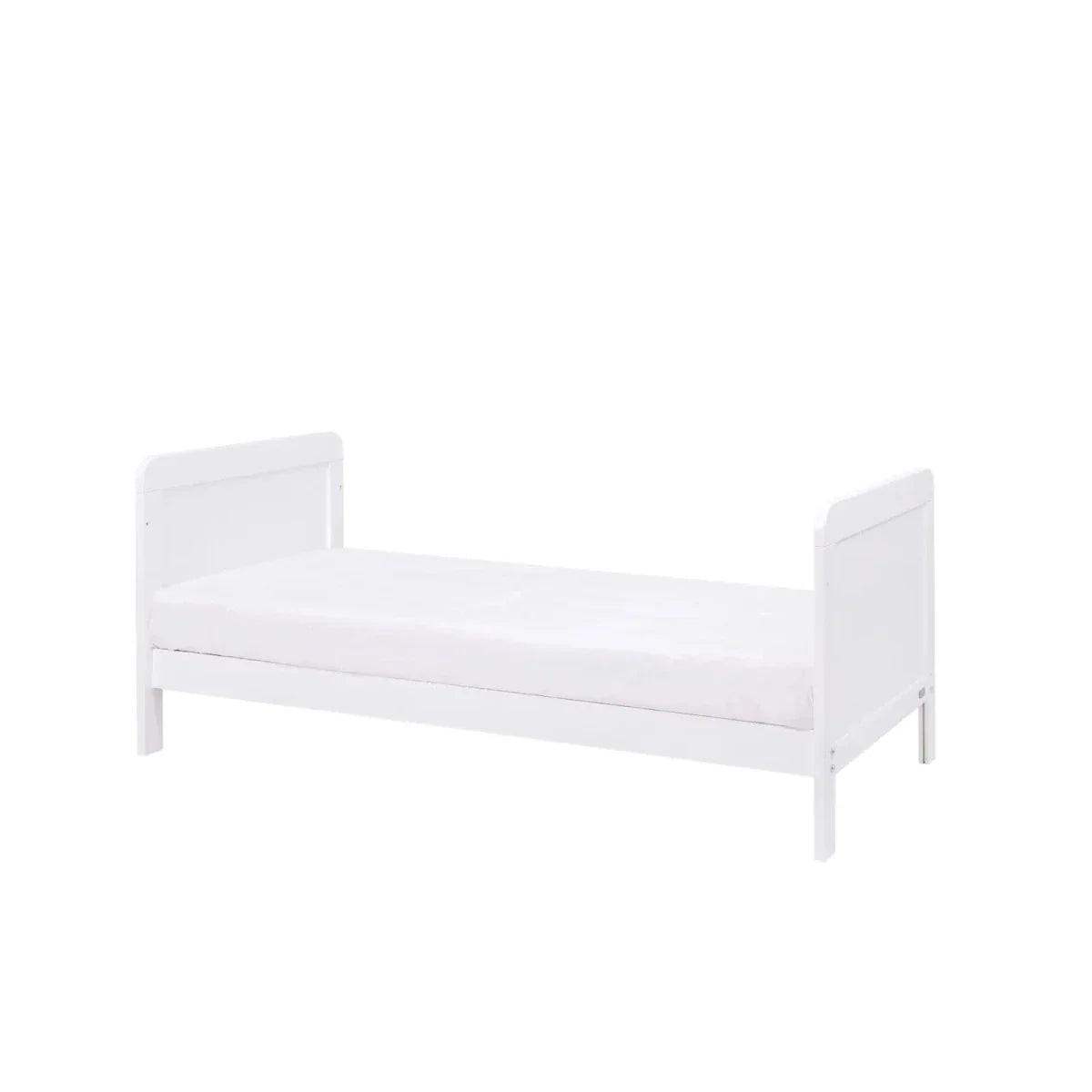 White junior bed-style cot with padded mattress and side rails