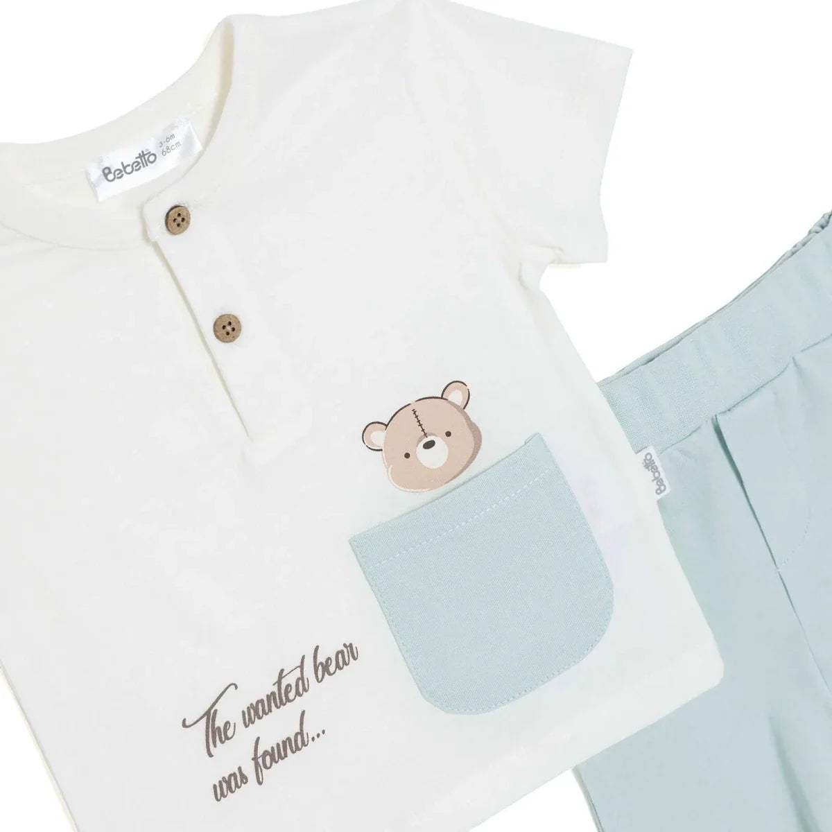 Boys white T-shirt detail with bear graphic, light-blue pocket, and button front