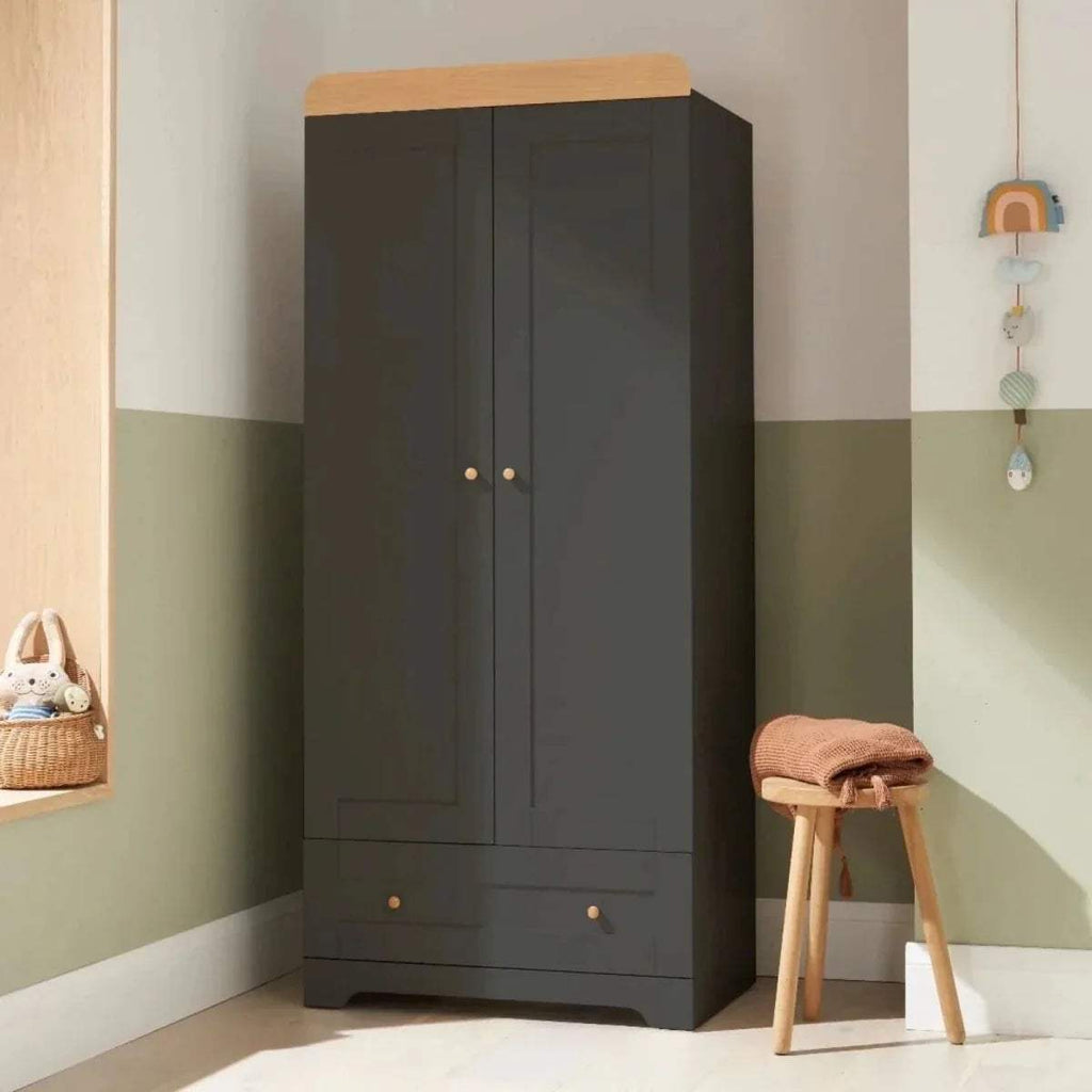 Kids wardrobe with slate gray doors and honey oak top, two panels and lower drawers.