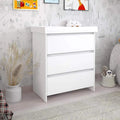 White baby changing unit with open cabinet shelves and fixed changing rail