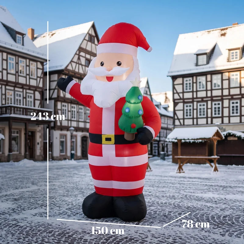 Inflatable red-and-white Santa with raised arm holding a glowing green mini tree