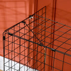 Black folding fire guard screen corner with tubular support bar and wire mesh