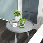 Grey round side table with flat circular top and four slender tapered steel legs