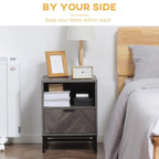 Dark grey nightstand with open cubby shelf, front drawer, and steel legs.