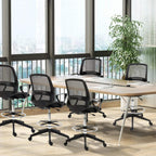 Black mesh back drafting chair with cushioned seat, swivel base, and footrest
