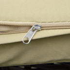 Beige cushion close-up with metal zipper pull along the stitched edge