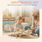 Gift-ready wooden baby drum kit with children playing on a small table
