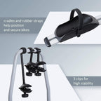 Black wheel cradles and rubber straps on a silver rear bike rack frame