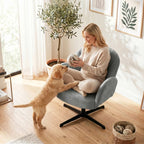 Grey shell swivel accent chair with wide arms and black metal star base