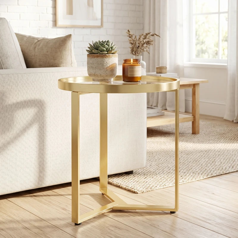 Gold round side table with clear glass top and sleek geometric gold metal base
