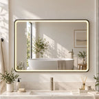 Black rectangle LED bathroom mirror above a bathtub with warm illuminated border