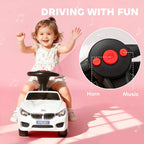 White ride-on car with black steering panel showing horn and music buttons