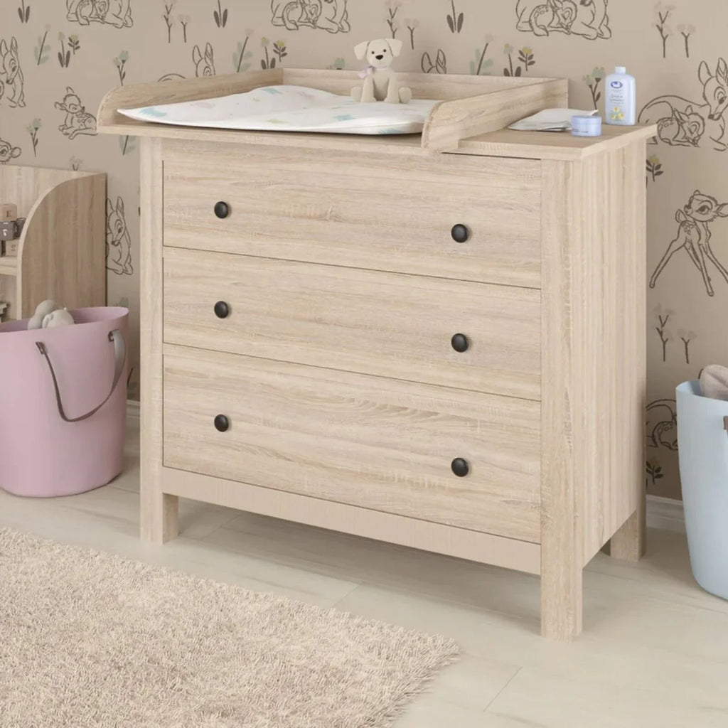 Oak kids dresser with wooden changing top and changing mat, four drawers with knobs