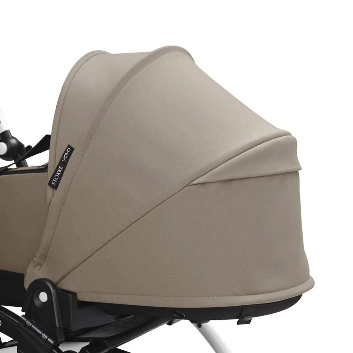 Taupe side view newborn shell with curved hood and black trim