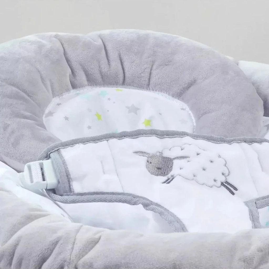 Grey baby bouncer seat pad with sheep print and safety harness straps