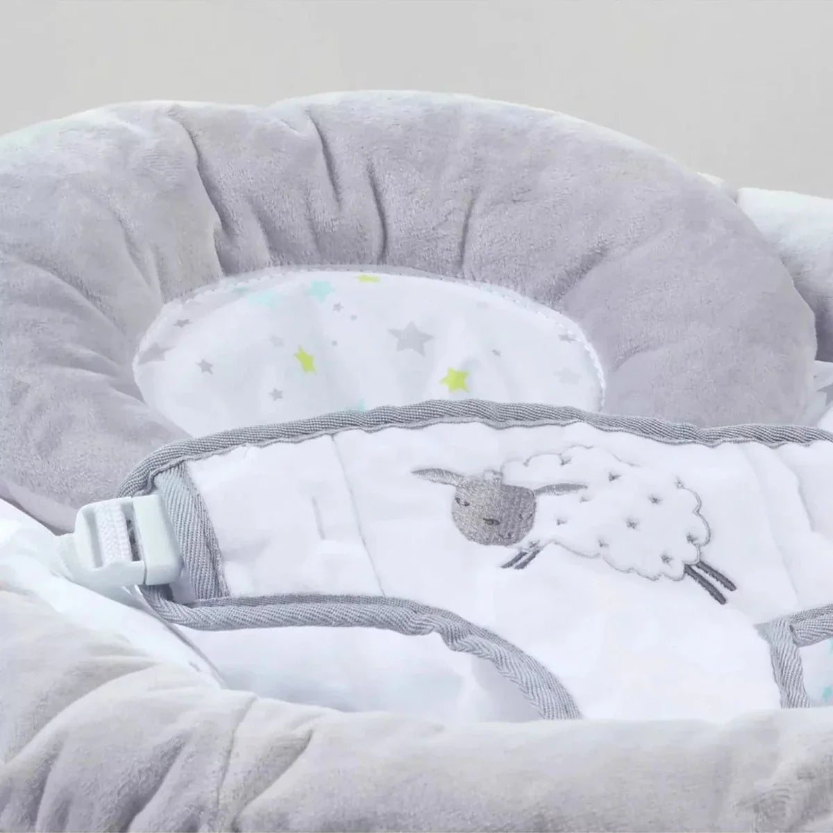 Grey baby bouncer seat pad with sheep print and safety harness straps