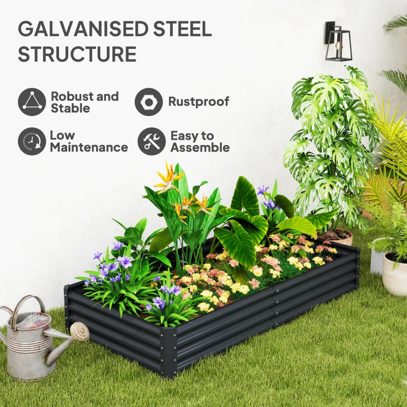 Dark grey galvanised steel planter with mixed green plants and flowering tops