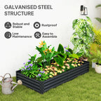 Dark grey galvanised steel planter with mixed green plants and flowering tops