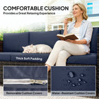 Outdoor sofa with thick dark blue seat cushions and removable cover details