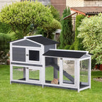 Grey wooden rabbit hutch with two compartments, mesh doors, and black ramp