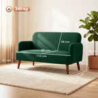 Dark green loveseat sofa with armrests and wooden legs, shown with size markings