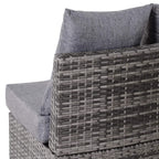 Grey rattan garden sofa corner with woven armrest and soft seat cushion and pillows