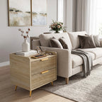 Natural wood end table with two drawers, rattan-style fronts, and gold metal legs