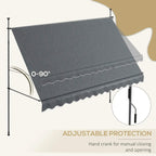 Dark grey manual retractable awning with hand crank control and scalloped valance