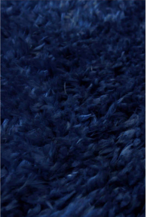 Navy shaggy rug close-up showing high pile texture
