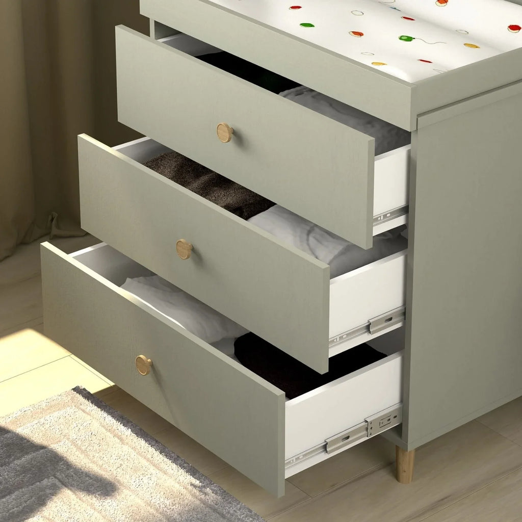 Grey changing dresser with drawers open, revealing inner shelf and changing rail