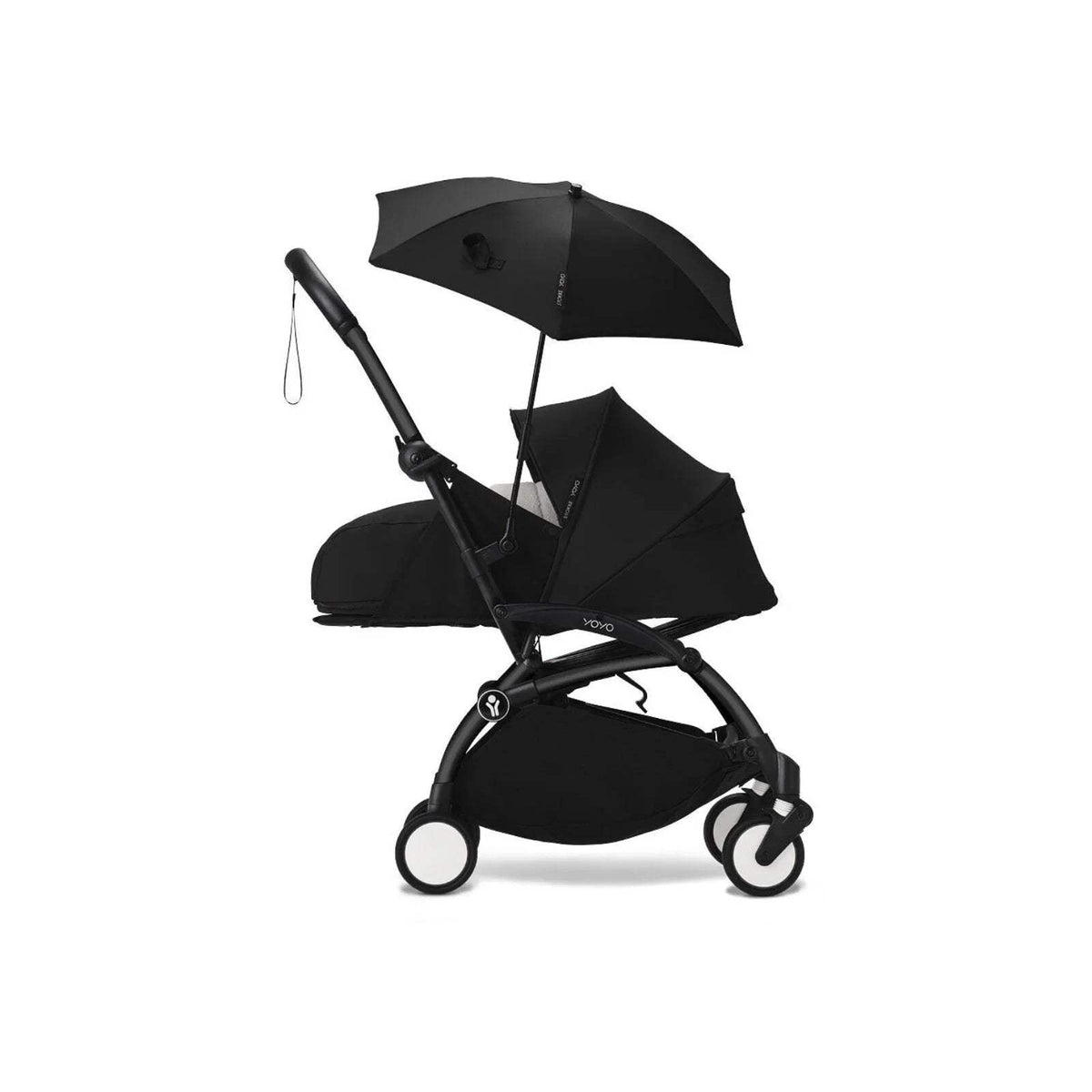 Black stroller parasol attached to pushchair, with open canopy and hanging strap