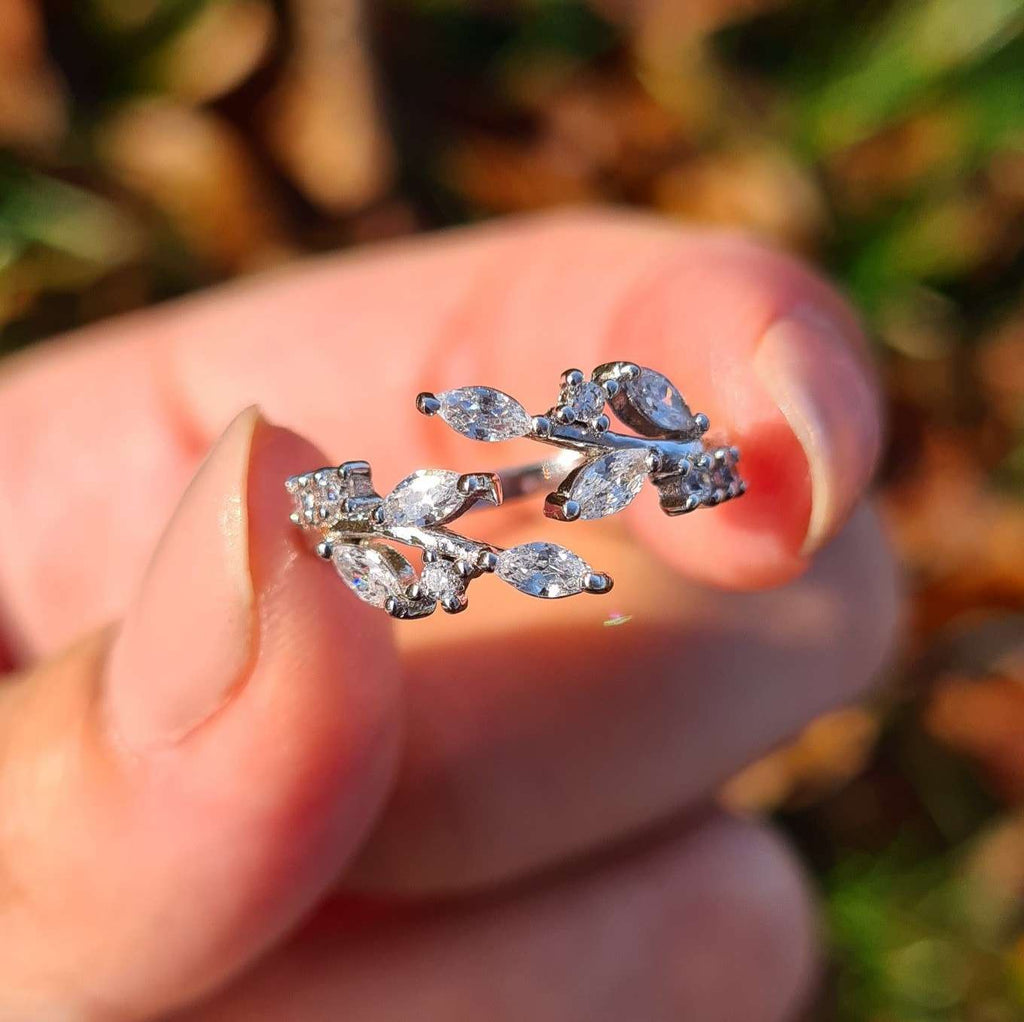 Sterling silver adjustable leaf ring featuring marquise stones and openwork design