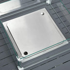 Clear glass fire pit insert lid over grey burner tray with control cap