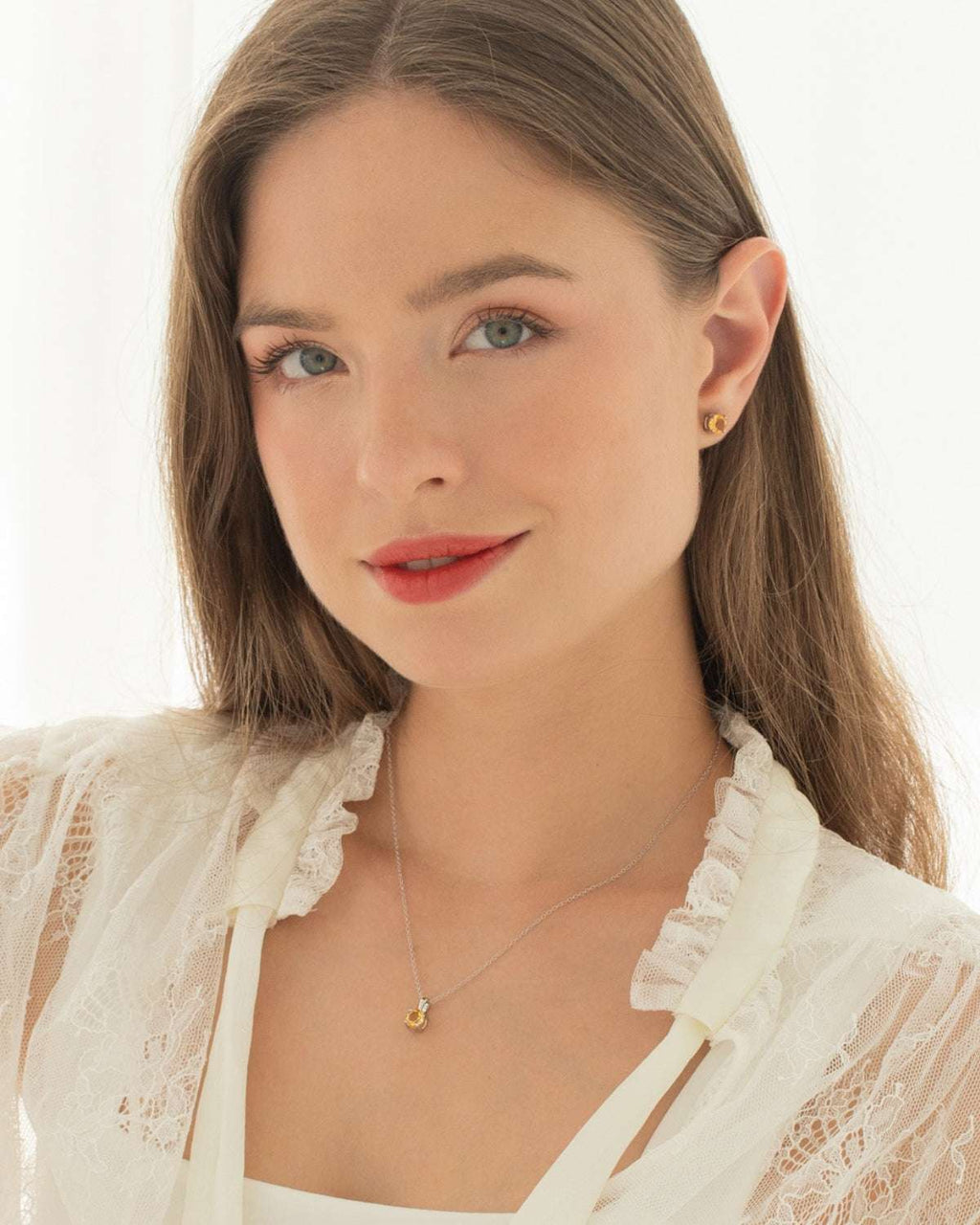 Sterling silver citrine solitaire pendant necklace worn at collarbone
