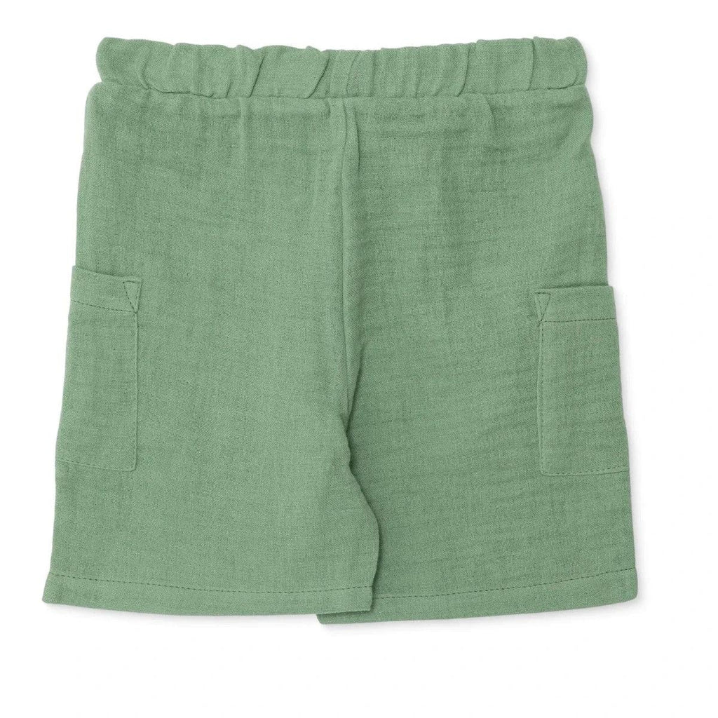 Muslin baby shorts in green, relaxed fit with elastic waist and patch pockets
