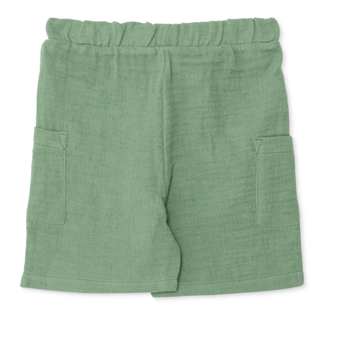 Muslin baby shorts in green, relaxed fit with elastic waist and patch pockets