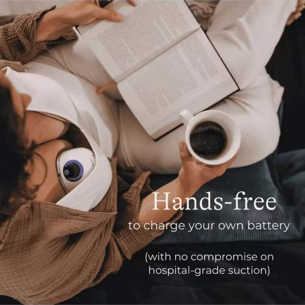 Wearable breast pump attached to a bra, with purple control dome