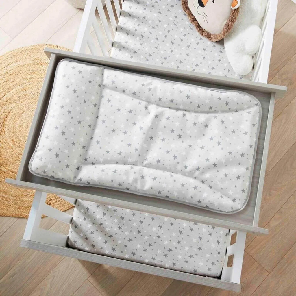 Cot top changer with grey star-patterned changing pad inside ash grey frame