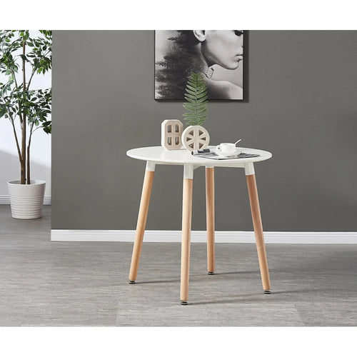 Round white dining table with light wood legs