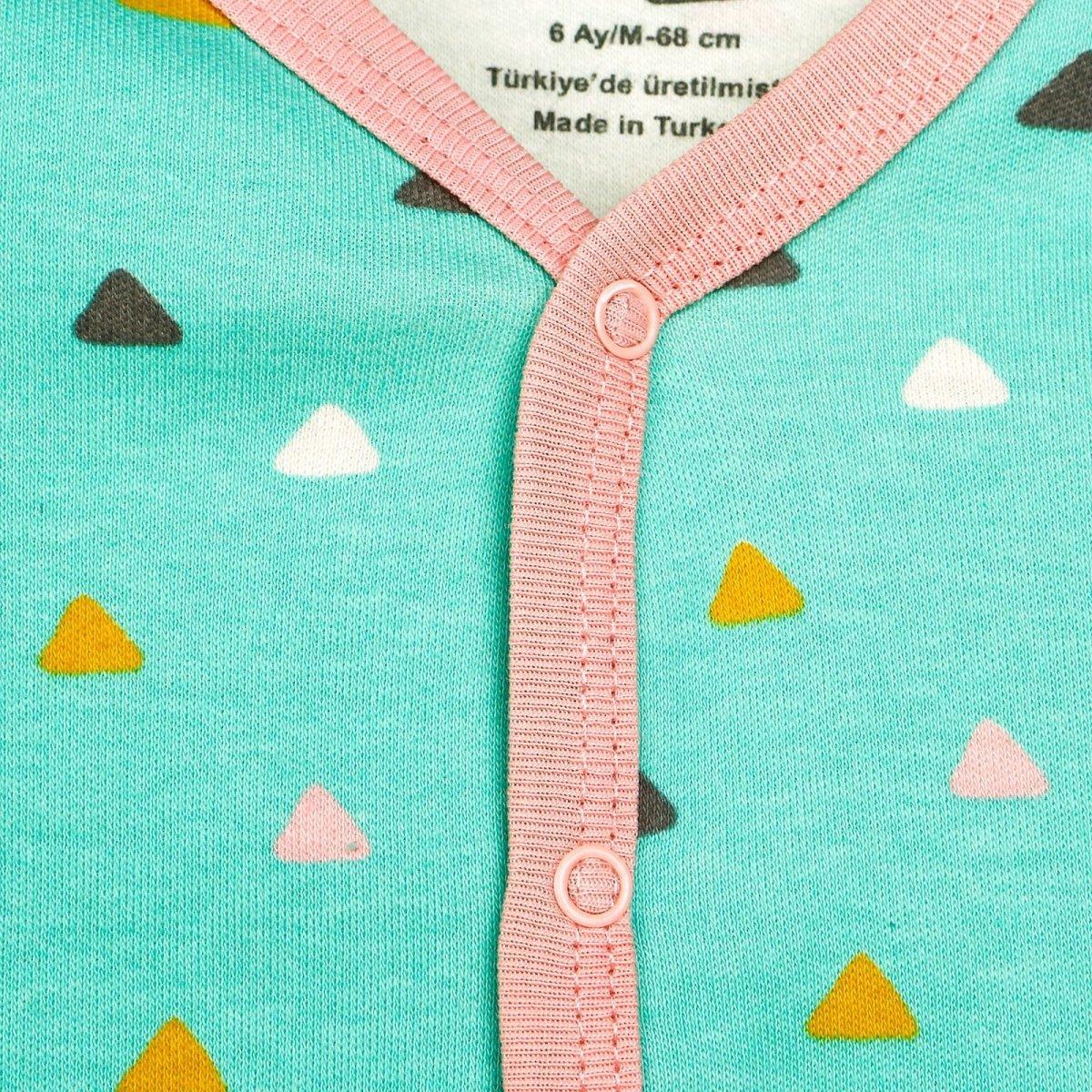 Mint baby pajama front with pink snap-button placket and triangle print.