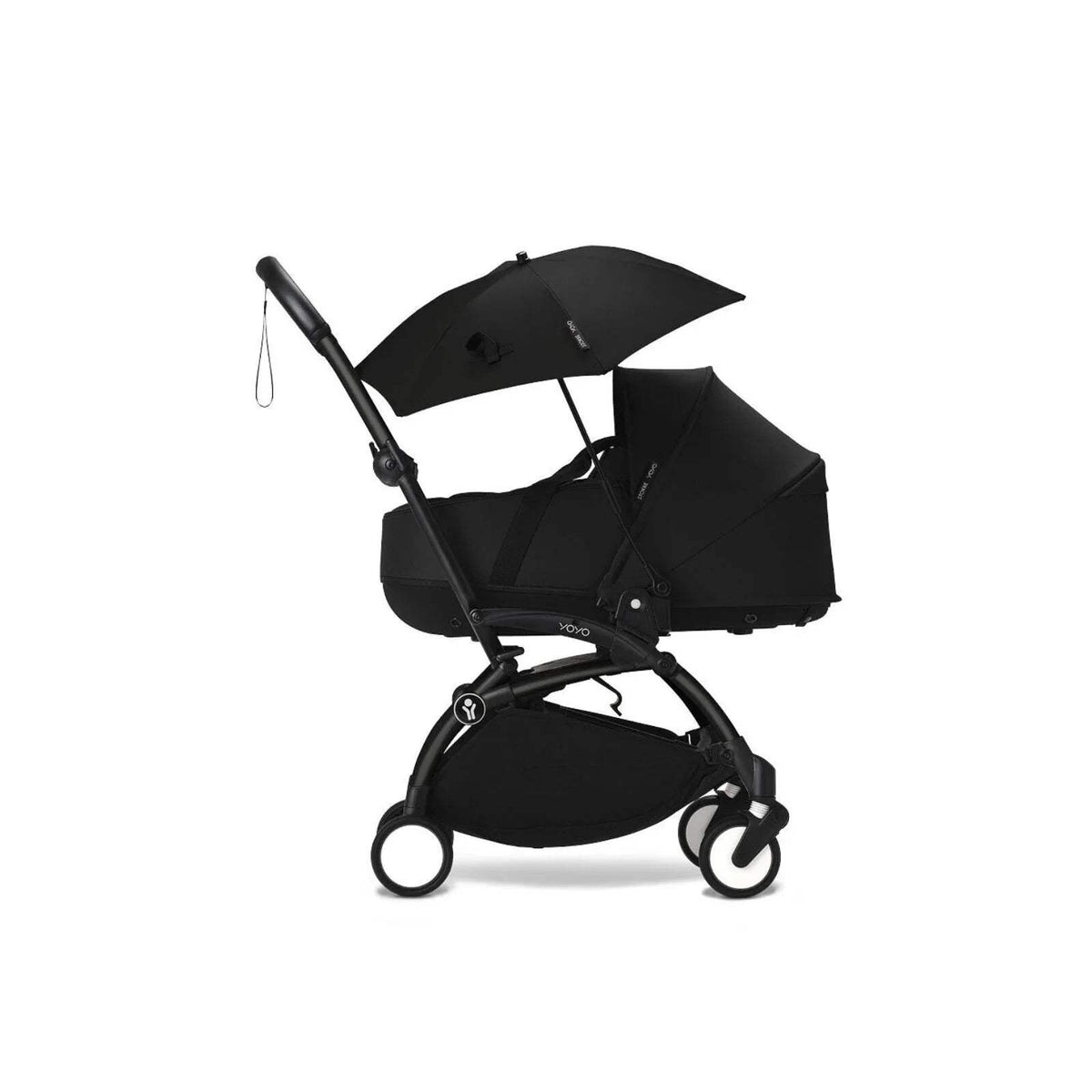 Black stroller parasol on pushchair, open canopy angled with side hanging cord