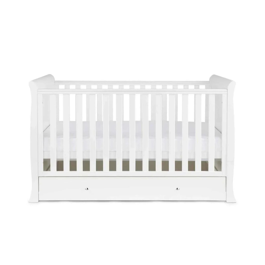 White cot bed with vertical slats and front drawer storage