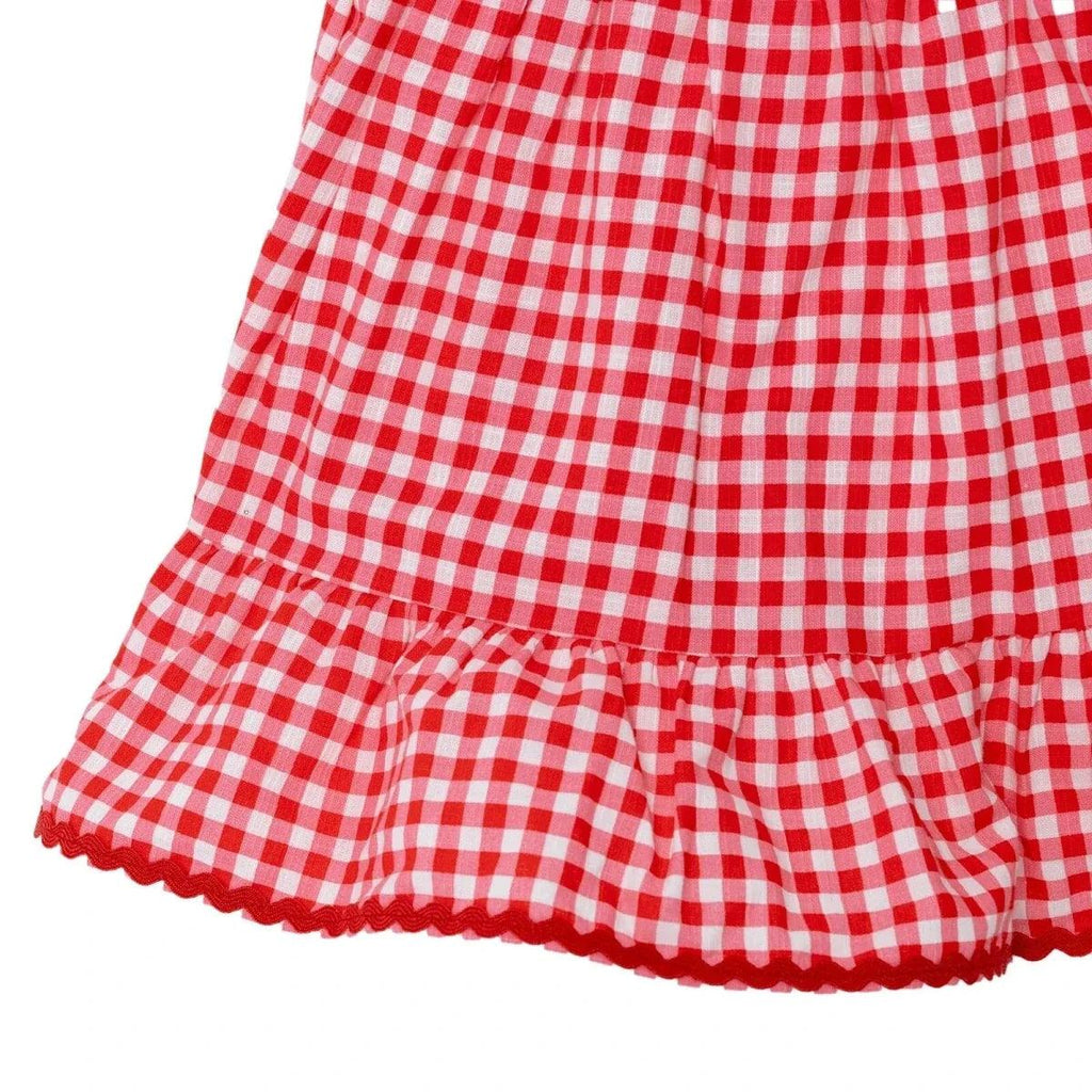 Pink gingham baby dress tiered hem with gathered ruffles and scalloped edge