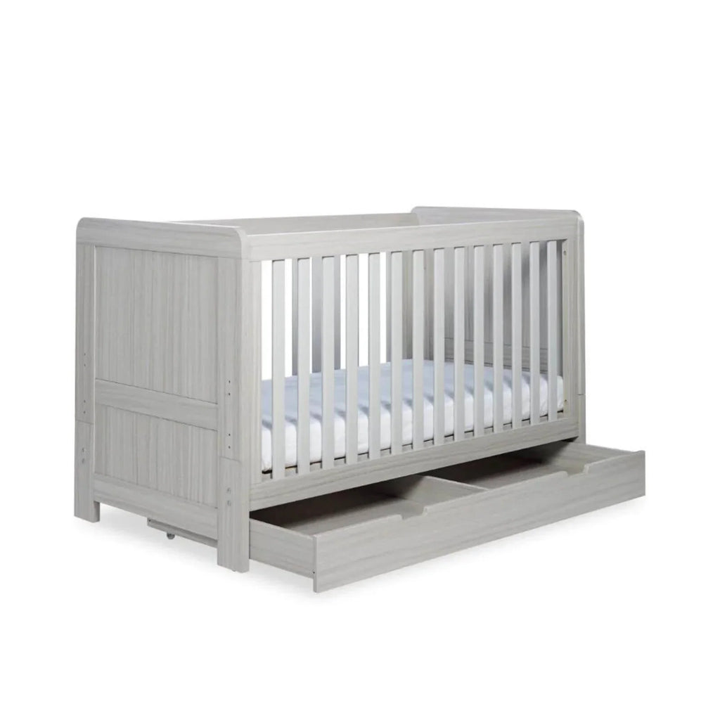 Ash grey cot bed with slatted front and side rails and under-drawer storage