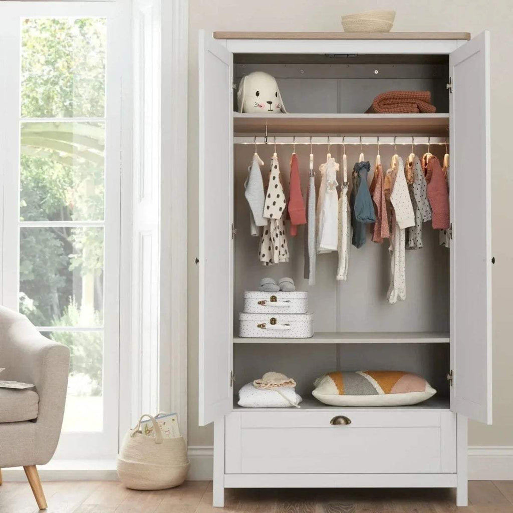 White wardrobe with open interior, hanging rail and shelves under oak top