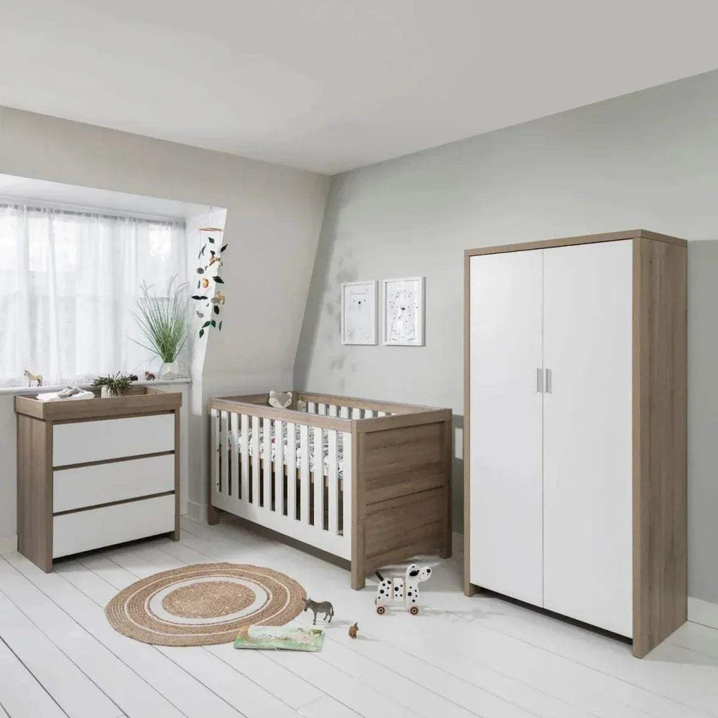 Light oak and white changing unit with three front panels and built-in changing top