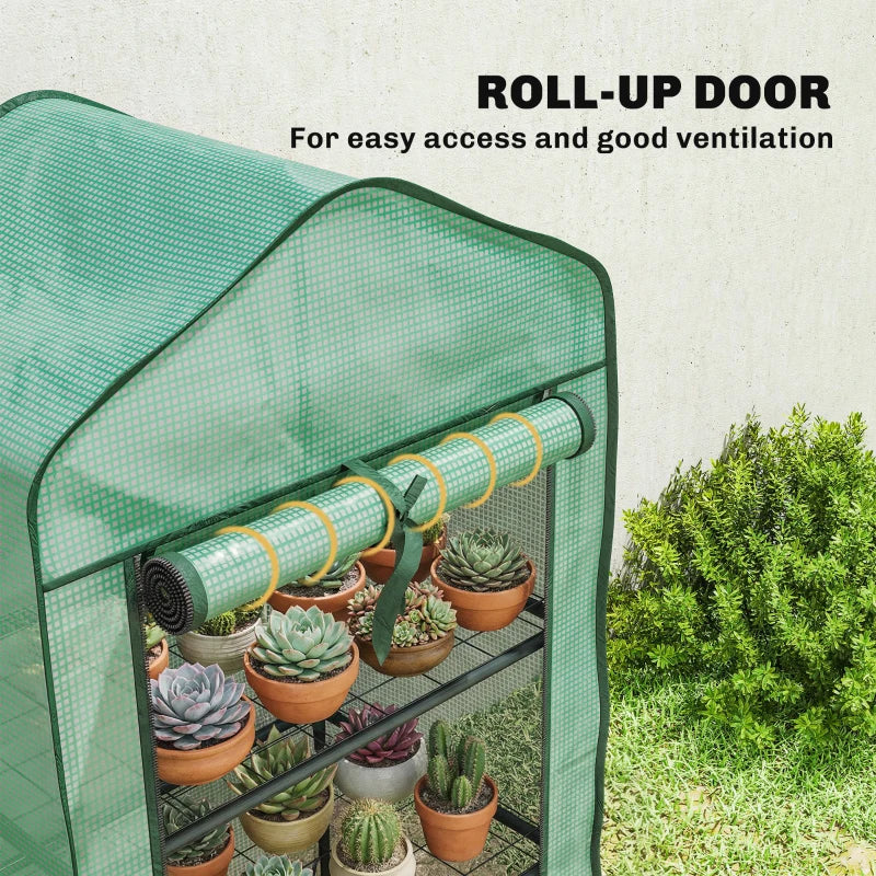 Green mesh mini greenhouse with rolled door and three interior wire shelves